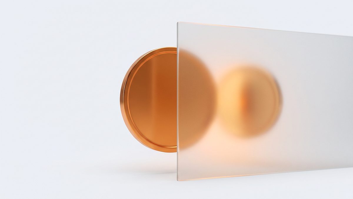 A frosted monero coin behind a pane of privacy glass, its surface unreadable